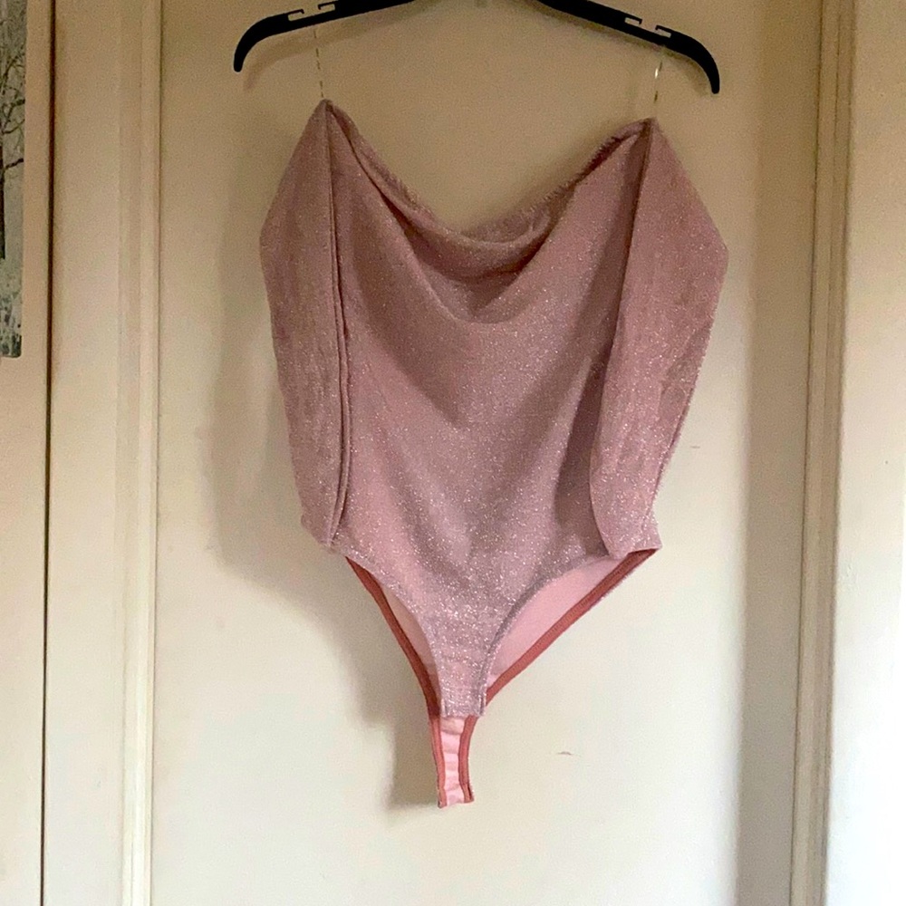 Pink sparkly open back bodysuit.